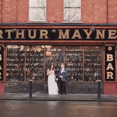 Couple standing outside Arthur Mayne Bar